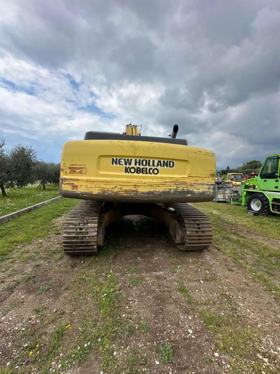 New Holland 305 Photo 11
