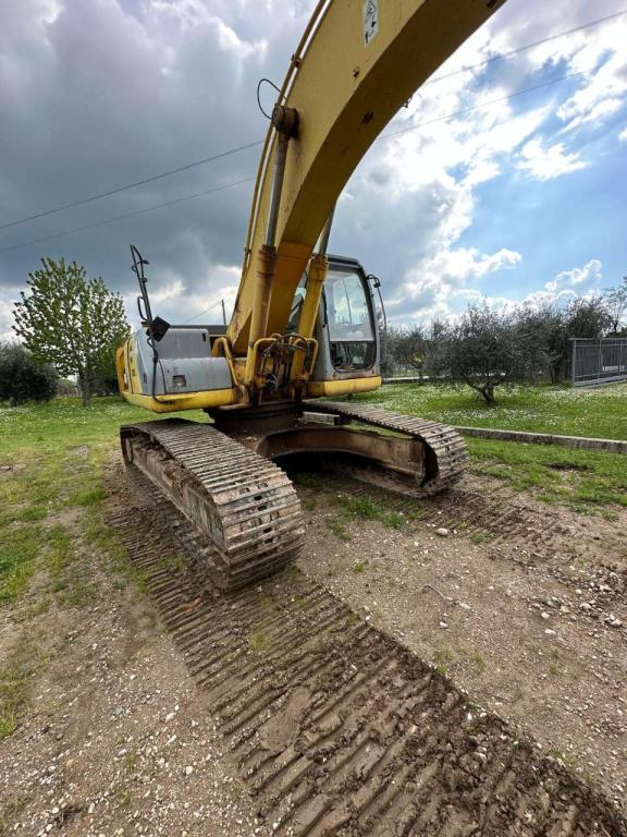New Holland 305 Photo 8