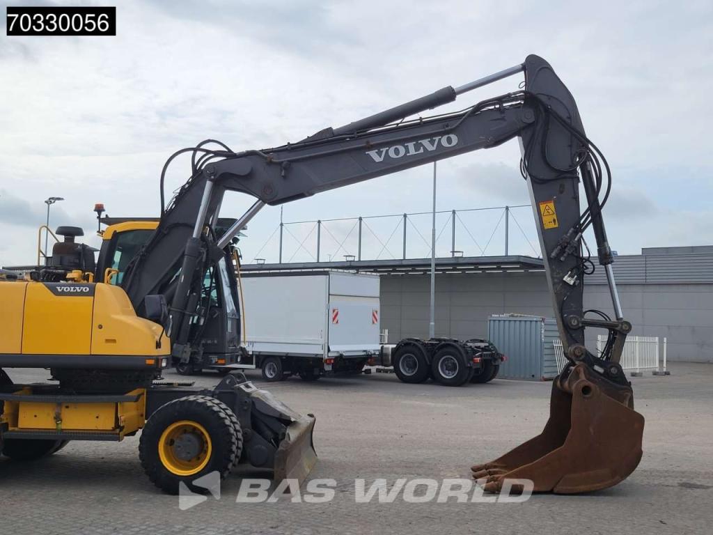 Volvo EW210 D Outrigers + Blade Photo 12